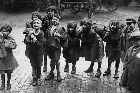 Getty Images In the early 20th Century, children collected coal fallen from the back of transport vehicles (Credit: Getty Images)