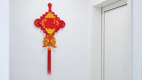 Getty Images Closeup picture of Chinese knot hanging on the wall