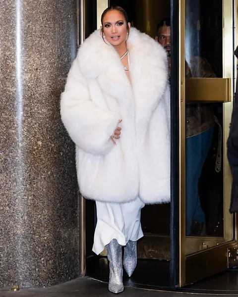 Getty Images Jennifer Lopez channels the Mob Wife look in glamorous white faux fur (Credit: Getty Images)