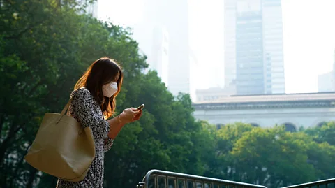 Getty Images A woman in New York City wears a mask