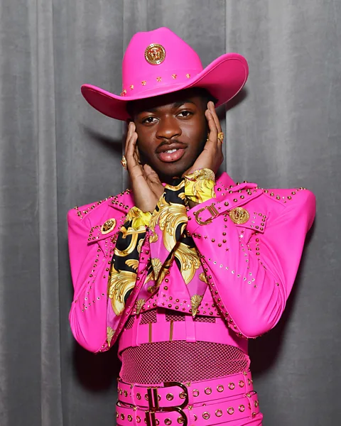 Getty Images Musician Lil Nas X sported a bright pink cowboy hat at the 2020 Grammy Awards (Credit: Getty Images)