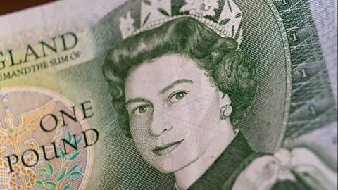 A close up of a £1 note with a portrait of Queen Elizabeth II.