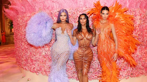Getty Images Kim Kardashian (center) wore a custom latex and beaded Mugler dress to the Met Gala in 2019 (Credit: Getty Images)