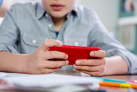 A child using a mobile phone.