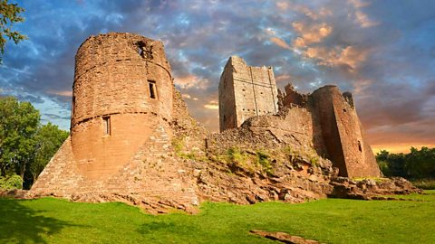 The ruins of a castle still supported by buttresses - stone bricks arranged to form a triangular support