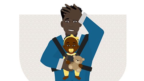 A man with his hand to his forehead and a baby strapped to his chest