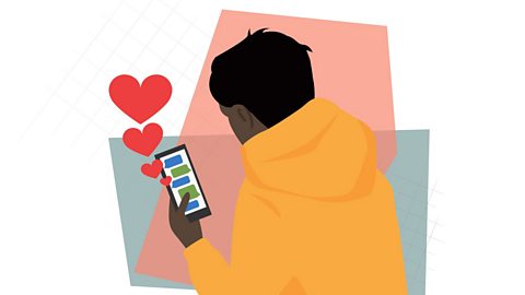 The back of a teenager wearing a yellow hoodie. They are holding a phone showing messages and love hearts.