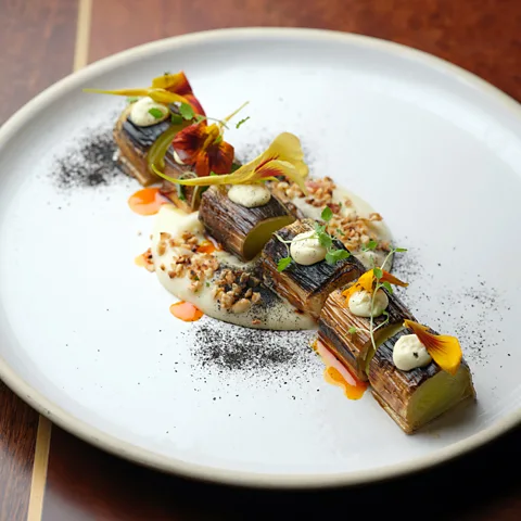 Cristian Barnett A vegetarian take on the Sunday roast: charred leeks with almond and olive vichyssoise (Credit: Cristian Barnett)