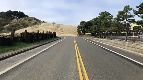 Nathaniel Scharping Without management of the dunes, clear roads like this one could become subsumed (Credit: Nathaniel Scharping)