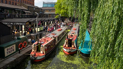 Getty Images three narrowboats in canal in Camden Market