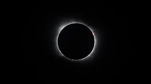 Getty Images A total solar eclipse occurs when the Moon goes between the Sun and the Earth, blocking all sunlight (Credit: Getty Images)