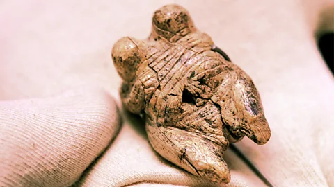 Getty Images The Venus of Hohle Fels is tiny, and thought to have been worn as a pendant (Credit: Getty Images)