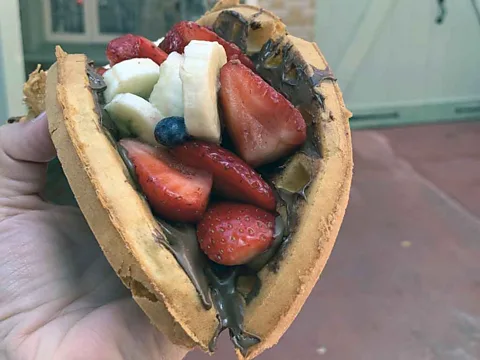 Carly Caramanna Spence rates Sleepy Hollow in the Magic Kingdom as his top pick for the amusement park's best snacks, like their signature Nutella waffle (Credit: Carly Caramanna)