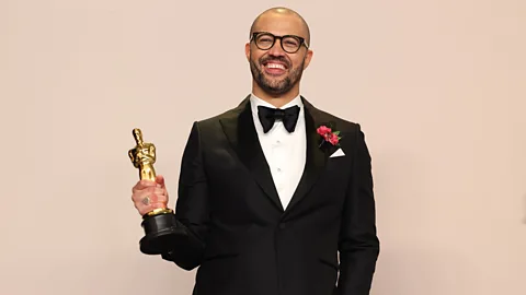 Getty Images Cord Jefferson won for best adapted screenplay for a story about a Black novelist realising that publishers only wanted stereotypical Black stories (Credit: Getty Images)