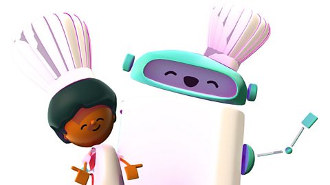 A boy and a robot smiling and both wearing chefs' hats