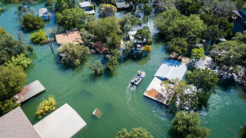 Getty Images Houses in a flooded area (Credit: Getty Images)