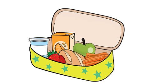 A yellow lunch box with blue stars on, containing a yoghurt, a carton of orange juice, two strawberries, a bread roll, an apple and carrot sticks