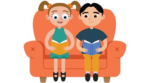 A boy and a girl reading books on a sofa.