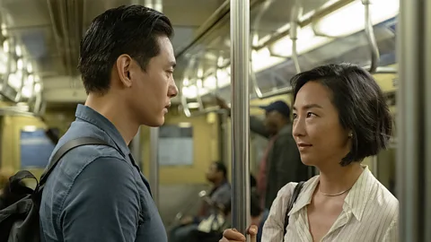 A24 Greta Lee and Teo Yoo in still from Past Lives (Credit: A24)