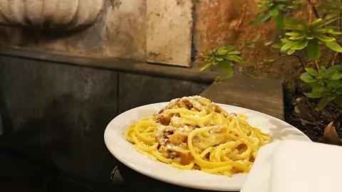 Andrea Carlo Martinez A plate of carbonara inside Checco er Carrettiere’s courtyard. It takes its name from its founder, Francesco "Checco” Porcelli (Credit: Andrea Carlo Martinez)
