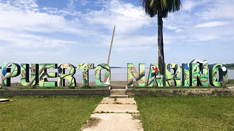 Brendan Sainsbury Town sign Puerto Nariño overlooking the Amazon River