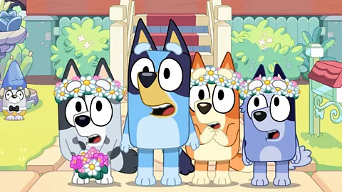 Ludo Studio A still of Bluey, Bingo, Muffin and Socks as wedding flower-girls in kids' TV series Bluey