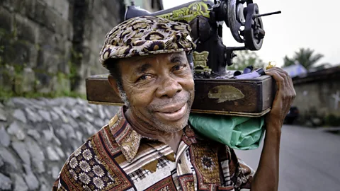 Getty Images Mobile tailors in Nigeria became known as "obiomas" in the 1970s (Credit: Getty Images)