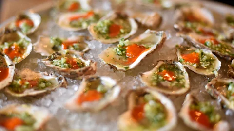 Getty Images Plate of dressed oysters on ice (Credit: Getty Images)