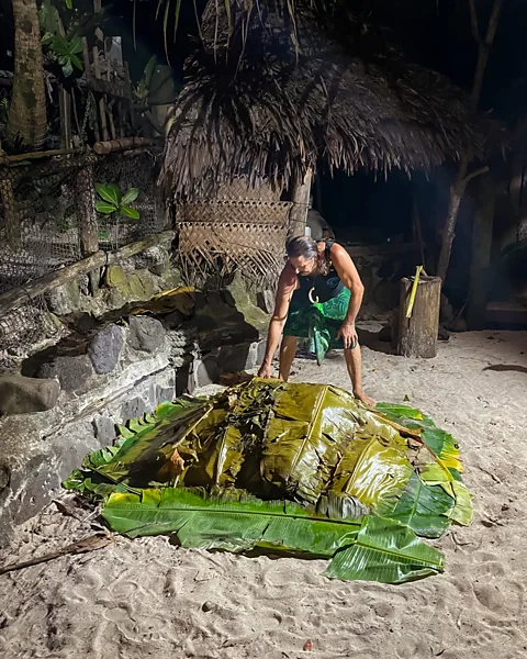 Emily Hart Every Wednesday, Tisa's Barefoot Bar hosts a traditional Samoan Umu feast (Credit: Emily Hart)