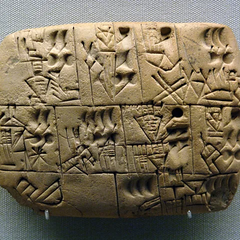 PHAS/Getty Images This clay Mesopotamian writing tablet shows an example of how beer was allocated in ancient times (Credit: PHAS/Getty Images)