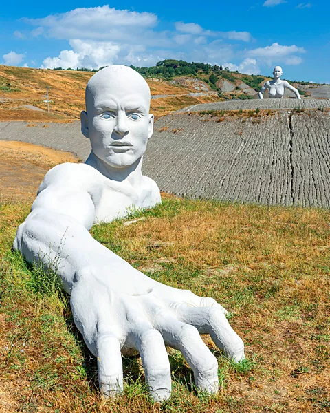 Alamy The village’s famous “giants” overlook the landscape (Credit: Alamy)