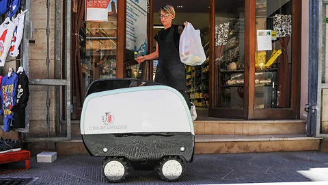 Getty Images One of Peccioli’s robots helps with shopping for the elderly (Credit: Getty Images)