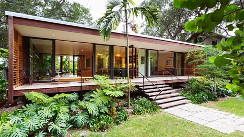 Claudia Uribe Despite being in Miami, Florida, this house has the feel of a tropical refuge, with outdoor living areas on front and back porches (Credit: Claudia Uribe)