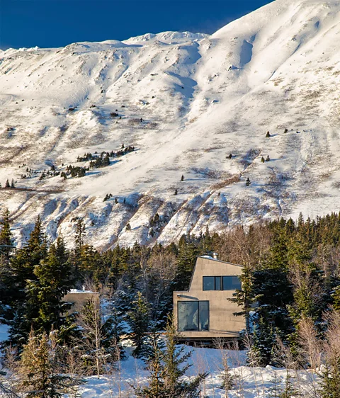 Kevin G Smith Photography Two off-grid cabins in Alaska's Chugach National Forest are fitted with solar panels and a rainwater collection tank, clad in cork for insulation (Credit: Kevin G Smith)