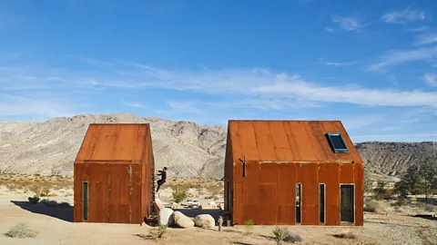 Sam Frost Made with weathered steel walls, Folly Joshua Tree runs on solar power stored on site and filters its own water, minimising heat with north-facing windows (Credit: Sam Frost)