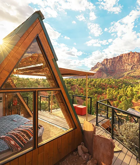 Ethan Abitz This 144 sq ft (13 sq m) A-frame might be small, but it has a grand backdrop in Zion National Park, Utah, with an entire wall that opens onto the deck (Credit: Ethan Abitz)