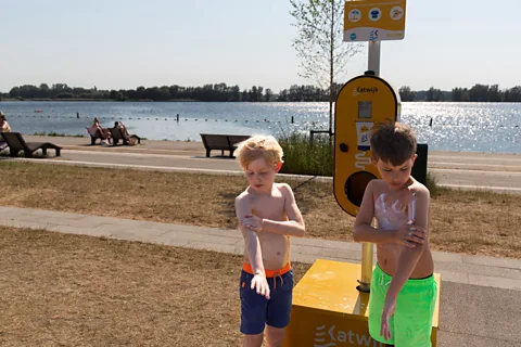 Getty Images The children of parents with fatalistic attitudes to cancer tend to use suncream less frequently (Credit: Getty Images)