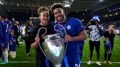 Reece James of Chelsea celebrates with the Champions League Trophy with Lauren James following victory in the UEFA Champions League Final 