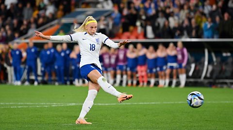 Chloe Kelly of England scores her team's fifth and winning penalty