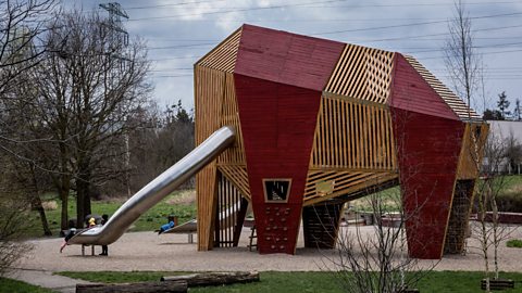 A children's play apparatus made into the shape of a mammoth with slides for tusks. 