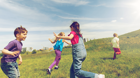 Four children playing tag