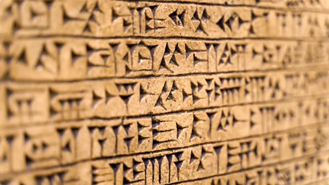 Getty Images The arrival of more complex societies – and the invention of written languages like Sumerian – may have also caused brains to shrink in size (Credit: Getty Images)