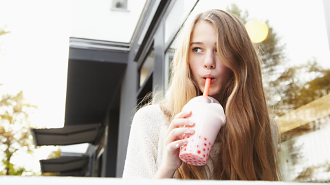 Girl drinking a cup of bubble tea