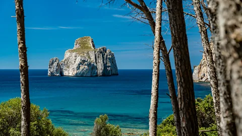 Gianni Alvito The iconic Pan di Zucchero sits just offshore from the historical mine of Porto Flavia (Credit: Gianni Alvito)