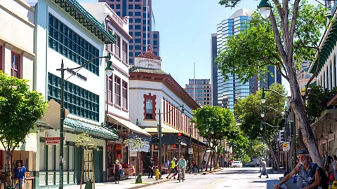 Alamy Honolulu's Chinese immigrants have played a huge role in shaping the town's culture, and Chinatown is one of the city's most vibrant neighbourhoods (Credit: Alamy)