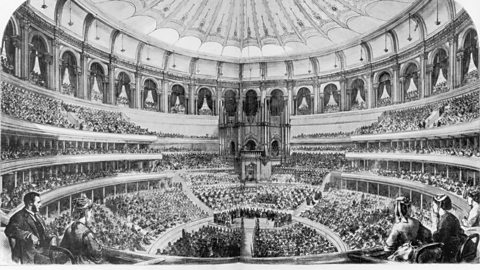 An illustration of the interior of the Royal Albert Hall on its opening day, showing the scale of the new building and spectators filling every seat