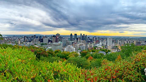 Getty Images Climb to the top of Mount Royal in Mount Royal Park and be rewarded with beautiful views of downtown Montreal (Credit: Getty Images)