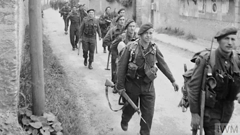 IWM (B 5067 Archive photo of soldiers marching on D-Day (Credit: IWM (B 5067))