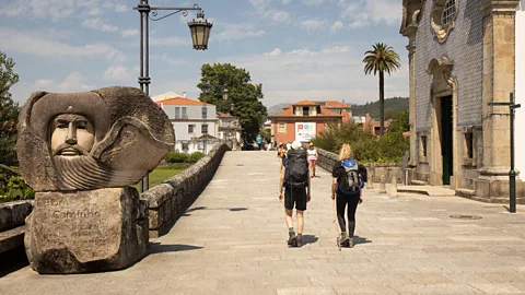 Alamy Two female hikers on the Camino Portugués at Ponte de Lima (Credit: Alamy)