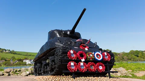 Getty Images A Sherman tank, sunk off the coast of Devon, now stands as a World War Two memorial at Slapton Sands (Credit: Getty Images)